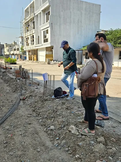 My team and I conducting a thorough site analysis. We work together to ensure every angle and degree is measured accurately for the Vastu report.