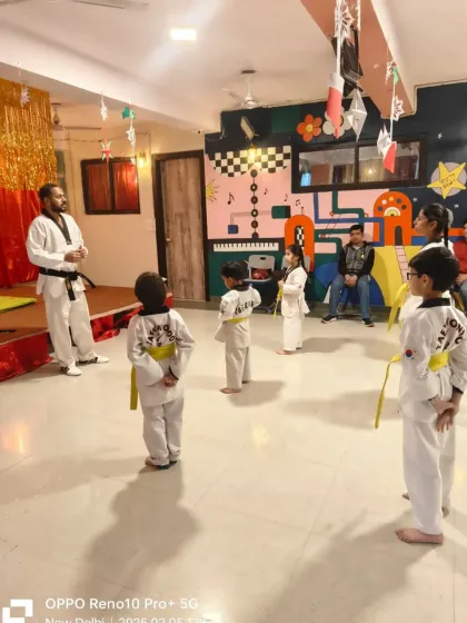 Students lined up and ready for their color belt test at our Palam branch. The test begins with a demonstration of discipline and respect.