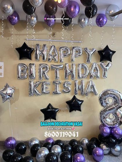 A simple BTS-inspired room decoration for Keisha's 8th birthday. The foil letter balloons are paired with black, purple, and silver star balloons.