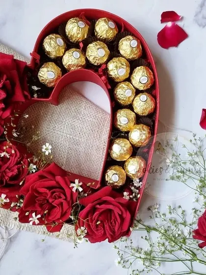A classic gesture of love. This heart-shaped box combines lush red roses with decadent Ferrero Rocher chocolates, making it a perfect gift for Valentine's Day, anniversaries, or just to show someone you care.