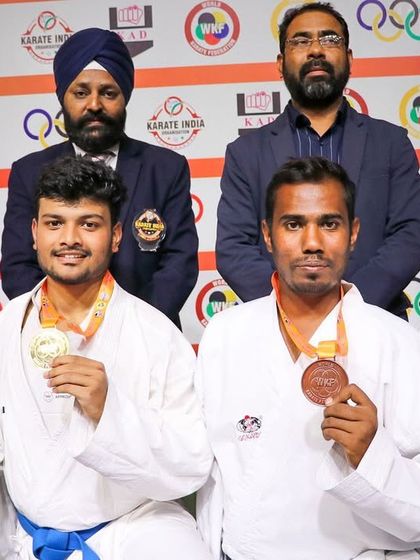 Posing with my fellow medalists at the All India Inter Zonal Karate Championship. It was an honor to win a bronze medal for Karnataka on the national stage.