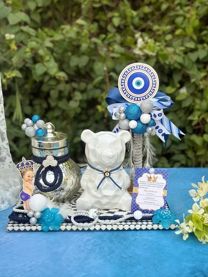 Shield your bundle of joy with style. This enchanting evil eye hamper combines protection and charm, featuring a modern white bear jar and traditional 'nazar' motifs.