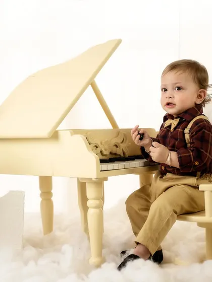 Examining the piano keys. I love capturing these small moments of discovery and curiosity.