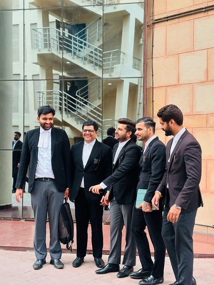 A candid shot of my team and me sharing a laugh between hearings.