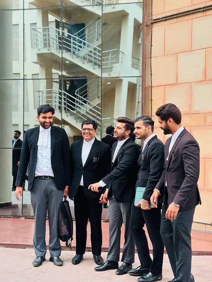 A candid shot of my team and me sharing a laugh between hearings.