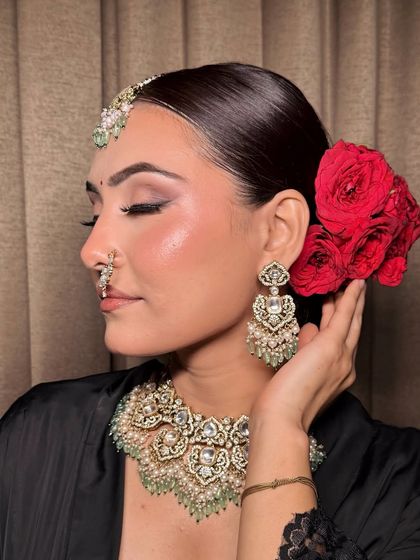 The side profile of this bridal look, showcasing the elegant hairstyle and how the makeup enhances her features.