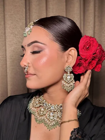 The side profile of this bridal look, showcasing the elegant hairstyle and how the makeup enhances her features.