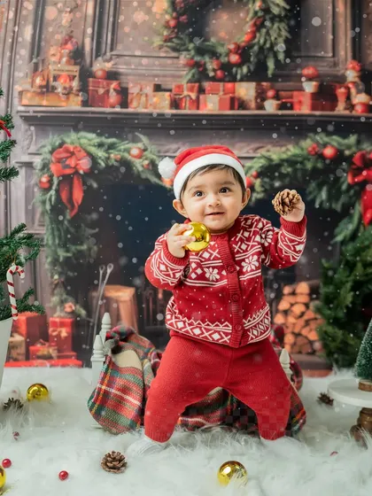 A sweet, smiling portrait of the toddler standing proudly in his festive outfit.