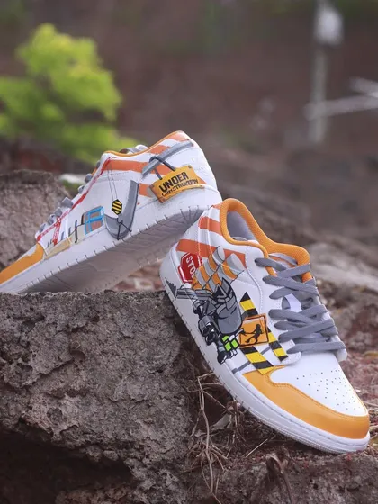 This project shows how I can tackle any idea. I designed these "Under Construction" themed sneakers for a ready mix concrete company, turning industrial elements like cranes and cement mixers into wearable art.