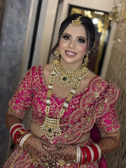 A bright, happy smile from a beautiful bride. Her makeup is flawless and radiant, designed to last through all the smiles and happy tears of the day.