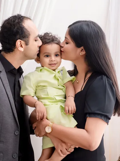 These are the moments that become your most treasured memories. I focus on capturing the quiet, unscripted love between family members, like this tender moment of parents kissing their little boy. It’s a simple, powerful portrait of family connection.