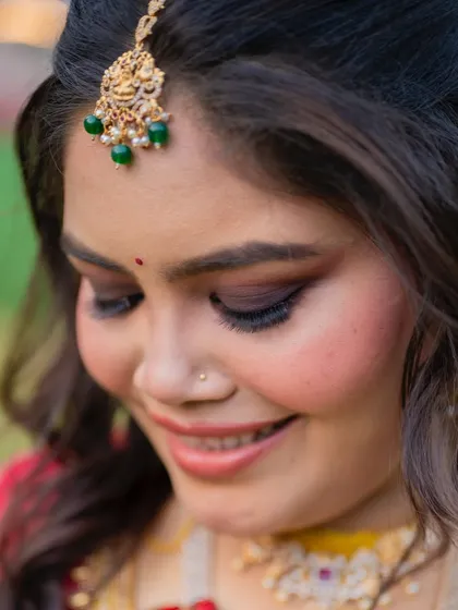 South Indian glam redefined. This close-up shows the subtle smokey eyes and glowing skin that create a timeless and elegant look.