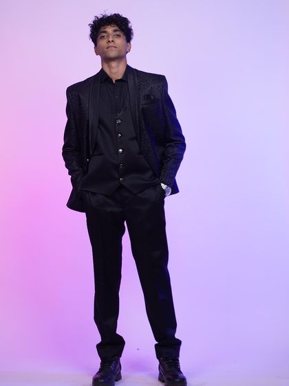 A full-length shot of the black jacquard tuxedo, a timeless and sophisticated choice for any formal event.