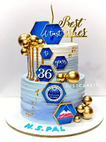 A corporate retirement cake celebrating 36 years of service. The design features the company's logo and a blue and gold color scheme for a professional look.