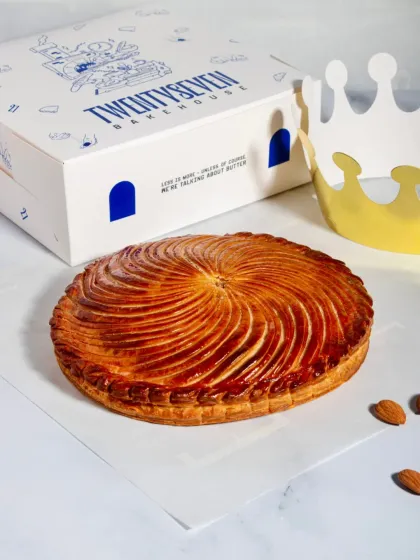 A whole Galette des Rois with its signature spiral pattern, ready for a celebration.