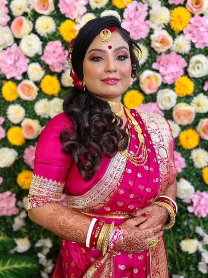 A final portrait of this lovely bride. Her happy smile is the best accessory, completing a look that is both timeless and beautiful for her wedding reception.