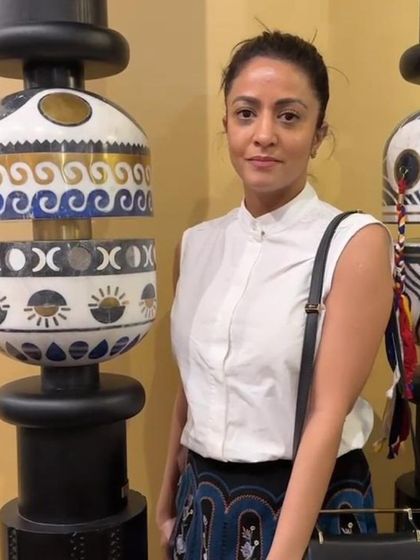 Farah Ahmed standing beside the 'Forces of Nature' pillar. This project was a collaboration with Within Design, bringing together eleven design minds to create unique interpretations of spirituality.