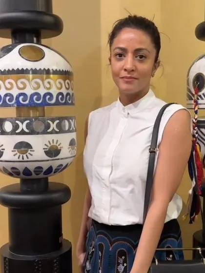 Farah Ahmed standing beside the 'Forces of Nature' pillar. This project was a collaboration with Within Design, bringing together eleven design minds to create unique interpretations of spirituality.