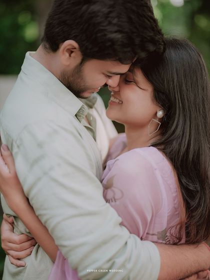 An intimate embrace between Simran and Pranjal. The soft focus and their gentle smiles create a warm and loving atmosphere.