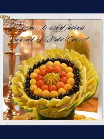 An example of my fruit artistry, this sunflower-shaped display is crafted from melon, oranges, and berries. It serves as a beautiful and edible centerpiece.
