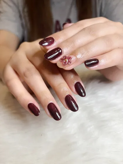 Another view of the deep maroon set, showing the placement of the 3D floral charm.