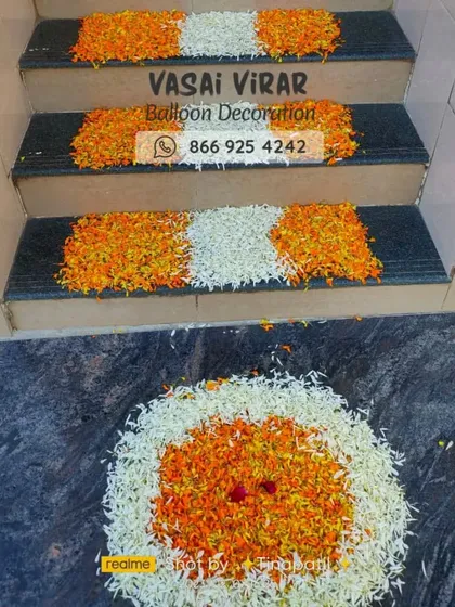 We also use fresh flowers to decorate other parts of your home. Here, we've created a lovely floral rangoli at the entrance and decorated the steps with patterns of orange marigold and white flower petals for a complete traditional look.