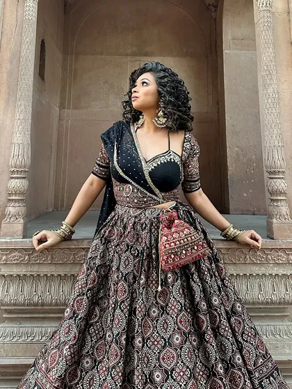 This is for my desi girlies who love a grand entrance. An Ajrakh print lehenga is perfect for a wedding or festive event. I focus on putting together complete looks, from the outfit to the smokey eye makeup and statement jewelry, ensuring you feel like a star.
