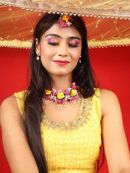 A close-up of the vibrant, multi-coloured eye makeup. This is a great option for a bride who wants something unique and fun for her Haldi.