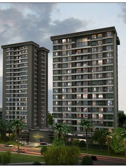 A dusk rendering of the "Palatina" apartment complex in Ghatkopar. The lighting highlights the clean, modern lines of the towers and the lush landscaping at the base.