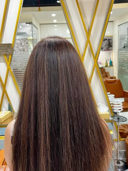 This client wanted subtle, natural-looking highlights to break up her dark brown hair. We added fine babylights for a sun-kissed effect that looks effortless and chic.