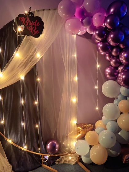 Another look at the beautiful and elegant backdrop for a bridal shower, perfect for photos and creating a celebratory atmosphere.