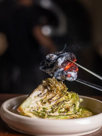 The classic Caesar salad with a smoky twist. The glowing charcoal imparts a unique flavor that elevates the dish.