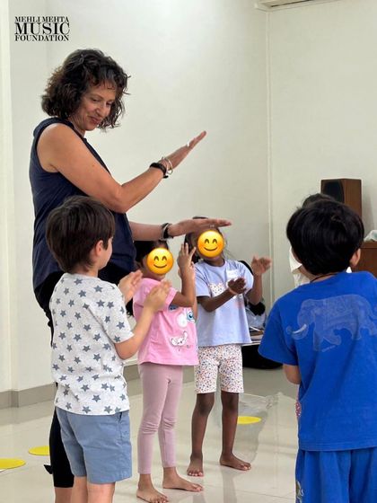 Our guest teacher, Naheed Shimala, guides students through a movement activity. We regularly invite international experts to teach our classes and train our faculty, ensuring the highest quality of music education.