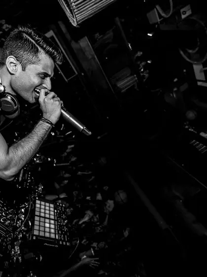 A black and white shot capturing my interaction with the crowd from the console at Da Bodega.