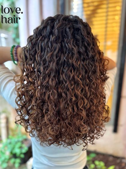 The back view of this beautiful brown balayage, showcasing the healthy shine and definition we maintain even after a colour service.