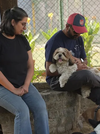 Pet parents relaxing and socializing while their dogs play nearby. Our dog parties are as much for the people as they are for the pets, creating a community of like-minded animal lovers.