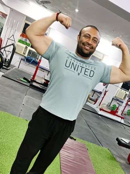 A quick bicep flex. Strong arms are essential for a stable bench press.