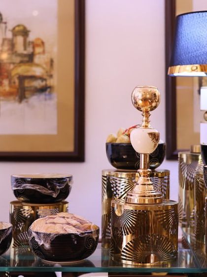 Another angle of our chaat station, showcasing the ornate, gold-toned serveware and decorative lamps that create a luxurious ambiance.