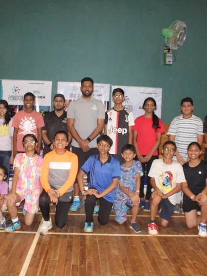 A group photo of kids and adults at our special coaching camp in Pune, showing the diverse age groups we cater to.