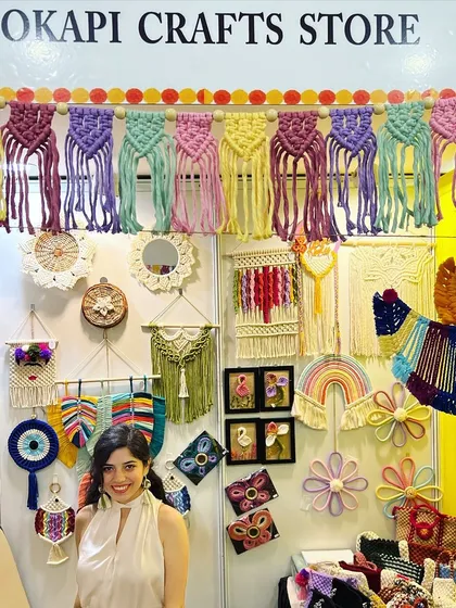 Here I am at a local exhibition, surrounded by my creations. It means the world to me to meet you all and share the macrame magic I pour my heart into every day.