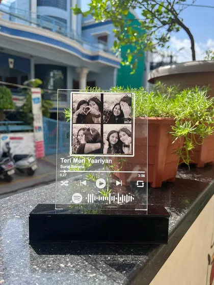 Here is the Spotify plaque displayed outdoors. It's a modern and meaningful way to celebrate your bond with your favorite human.