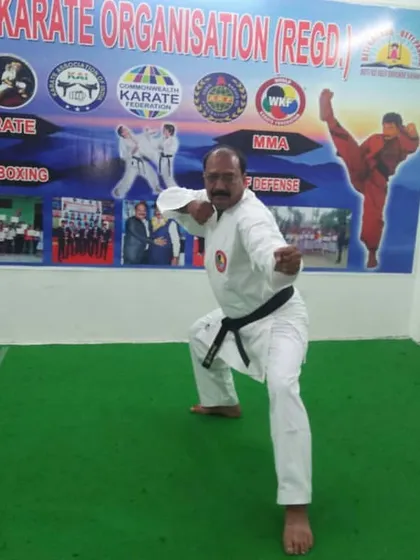 Our head instructor demonstrates a classic karate stance, showing the form and focus that we pass down to all our students.