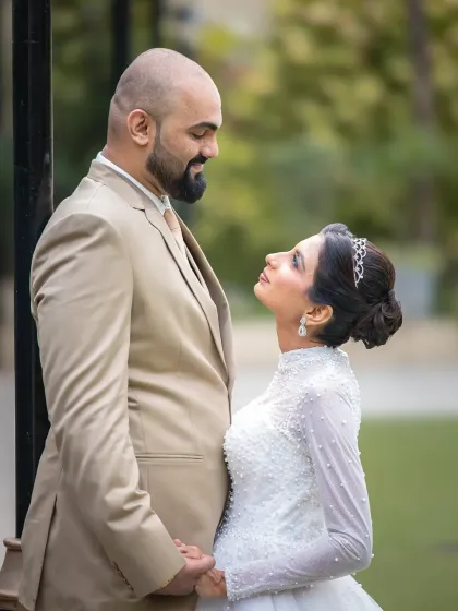 A beautiful close-up capturing the intimate connection between the newlyweds. Their smiles say it all in this timeless wedding portrait.