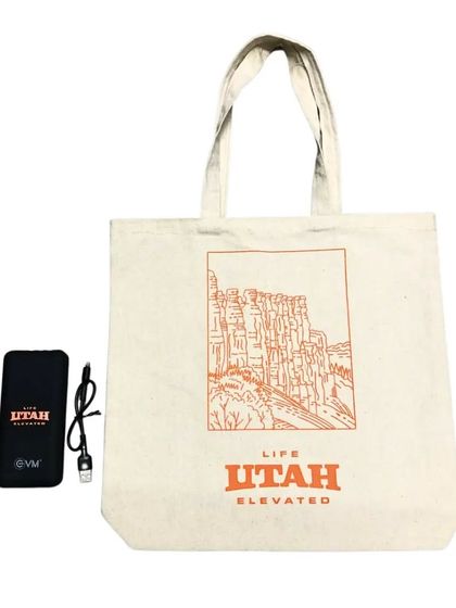 A powerful combo for a corporate giveaway. This set includes the custom 'Life Elevated Utah' tote bag paired with a matching branded power bank.