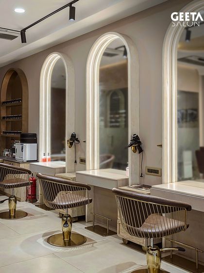 The styling section of our Maple Tree salon, featuring arched mirrors and warm lighting for a sophisticated and comfortable experience.