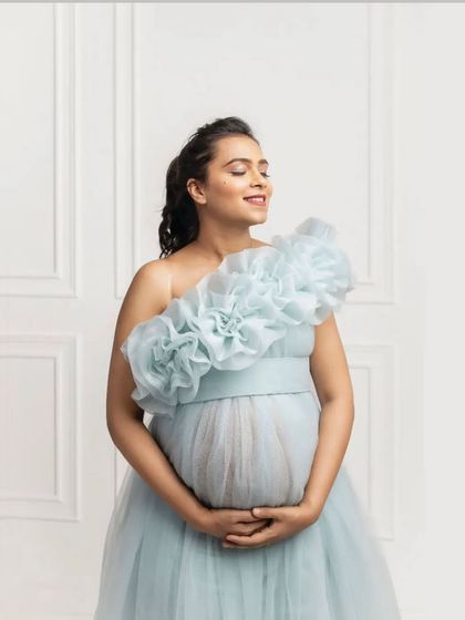 Another beautiful portrait showing the versatility of the ice blue gown's neckline, worn here as a one-shoulder style. It’s all about finding the look that makes you feel your best.