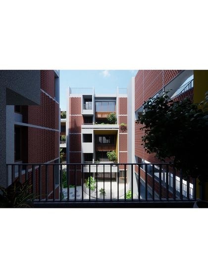A view from a balcony in "The Mandala," a low-rise, high-density housing project. The design uses brick screens (jaalis) and layered balconies to create a rich, textured facade that balances privacy with connection to the community.
