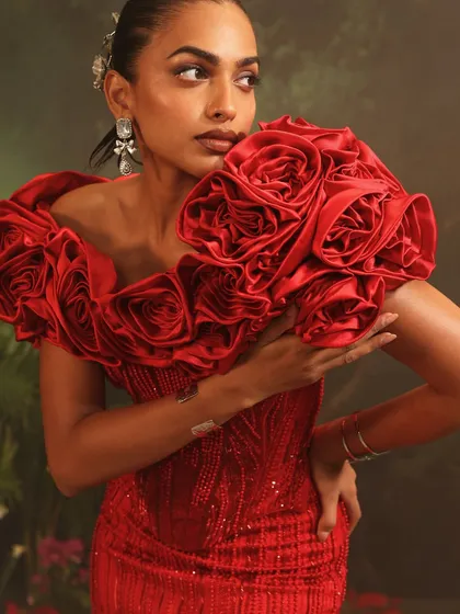 A close-up of the Bellerose Gown's red 3D rose cape. I designed this to be a showstopping feature, with each rose meticulously crafted by hand.