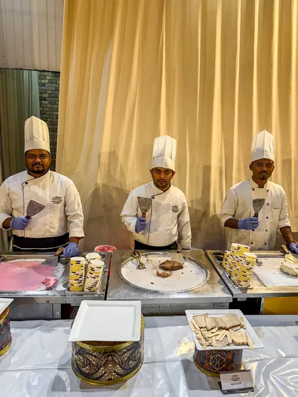 Our team of chefs at the live ice cream roll station, ready to serve. This interactive dessert counter adds a fun and modern touch to any celebration.
