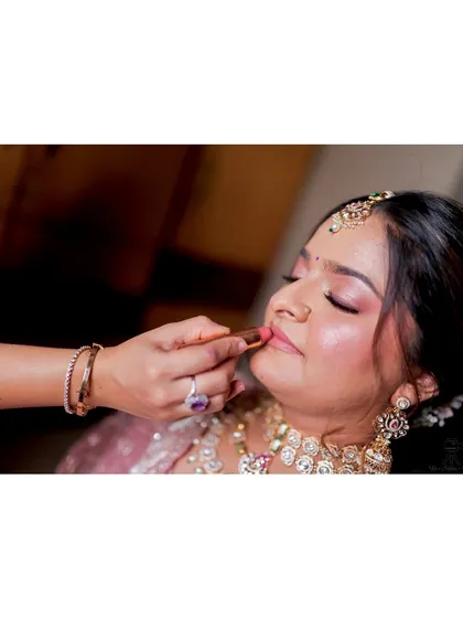 The final touch. Applying lipstick is the last step that brings the whole look together.